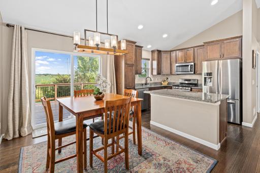 The gorgeous warm toned wood cabinets and granite counters make this the heart of the home.