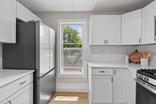 Upper level new kitchen with SS appliances, new cabinets, countertops and LVP flooring