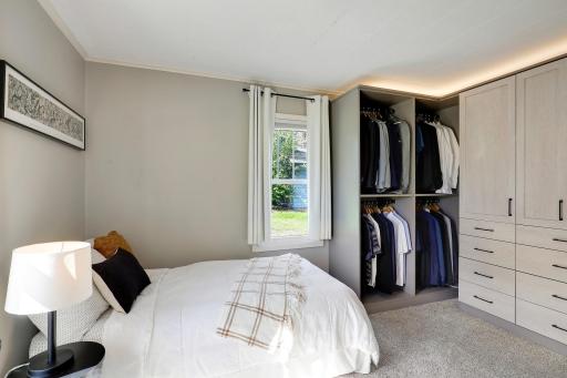 The second bedroom has a custom closet system for wardrobe needs.