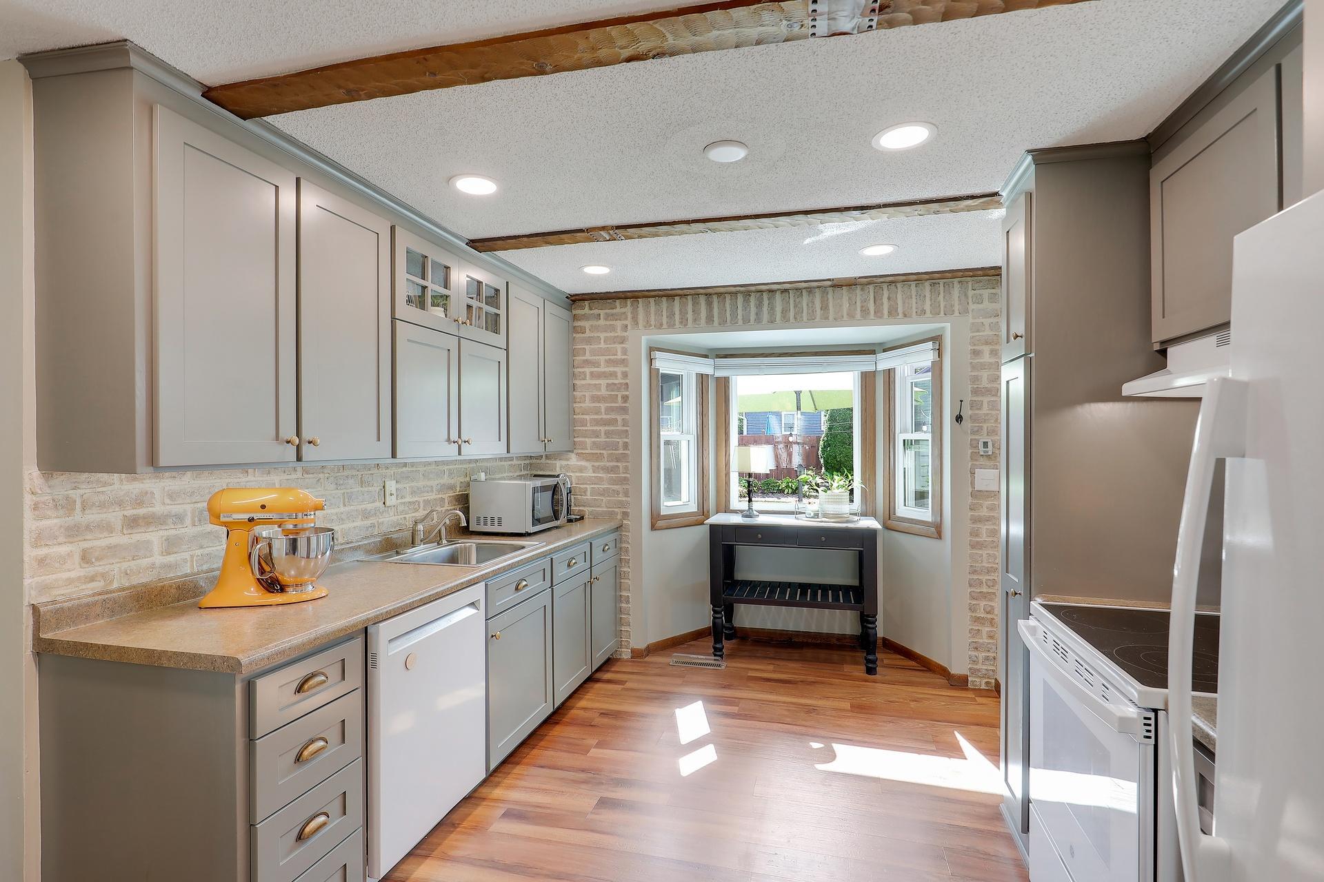The light and bright updated kitchen overlooks the back yard.