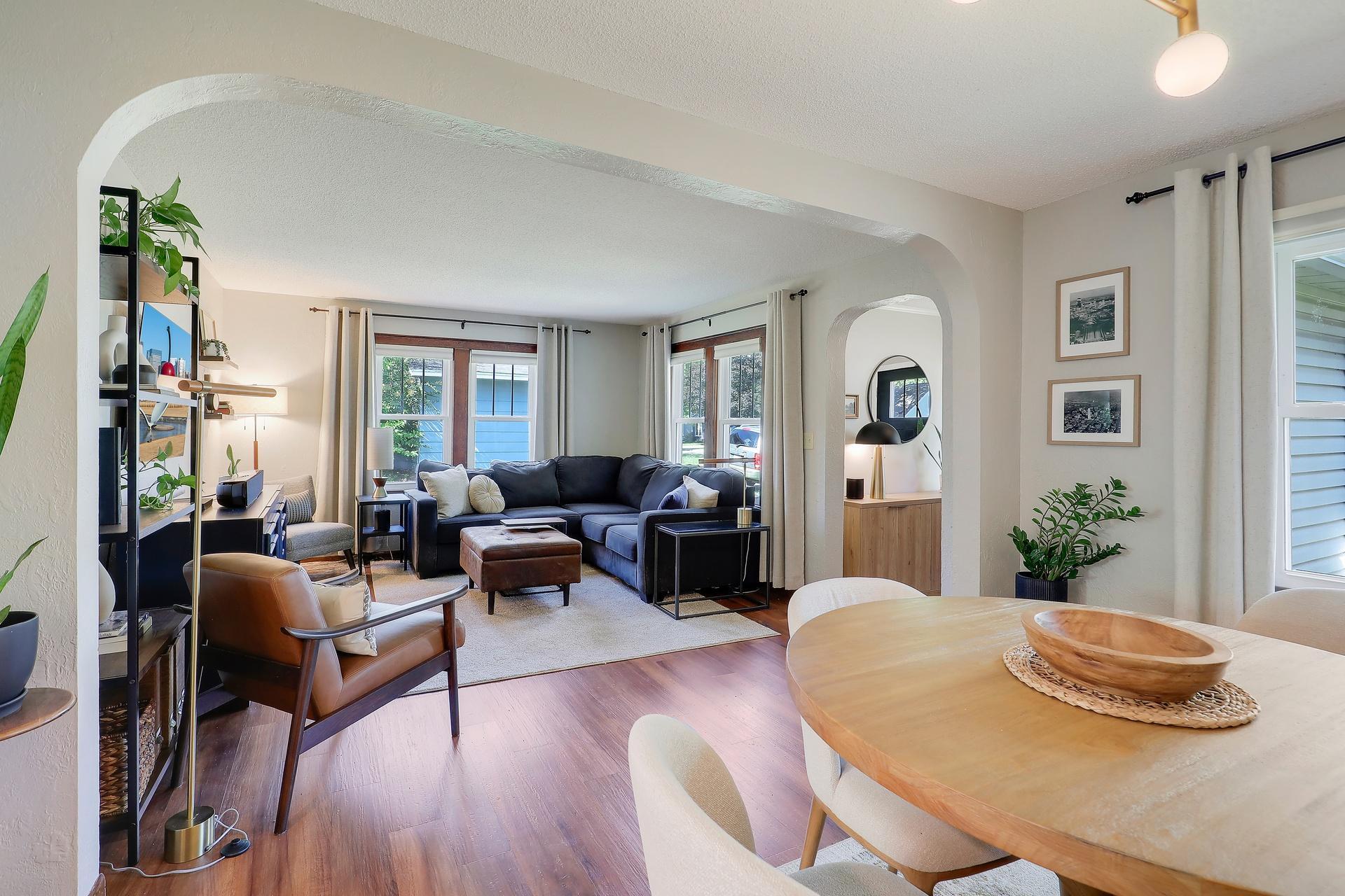 The arched entry way rounds out the charm in this main floor living area.