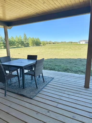 Exterior: Covered Porch and Yard view
