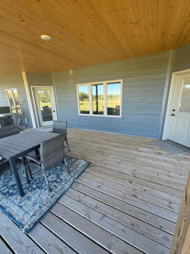 Exterior: Covered Porch with Exterior Doors to Dining Room and Master Bedroom