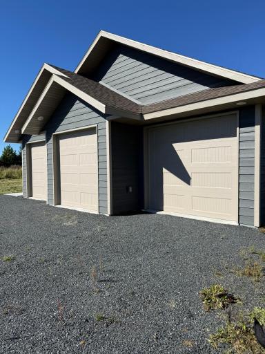 Exterior : 3 Stall Garage with Recessed Soffit Lighting