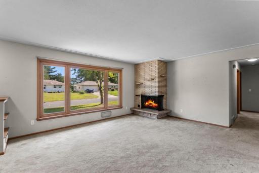 Main Level Living Room With Wood Burning Fireplace