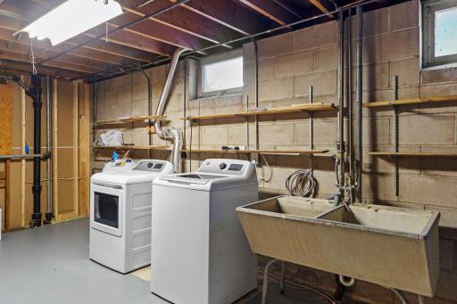 Clean and Dry Utility Room With Updated Washer and Dryer