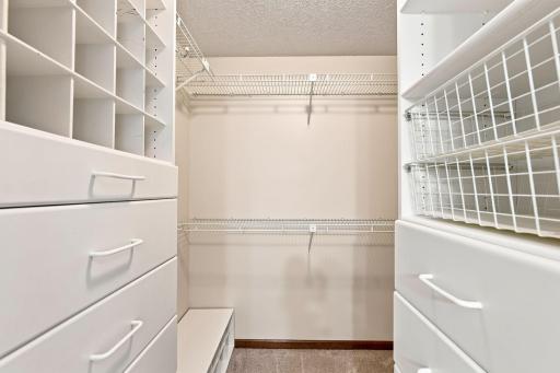 Primary Walk In Closet with Custom Built In Cabinerty!