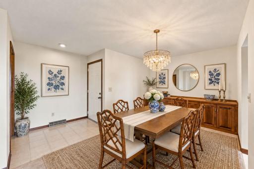 Formal Dining Room with Large Built In Credenza! Virtually Staged table and Light fixture