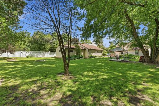 Amazing Fenced in Backyard with mature trees