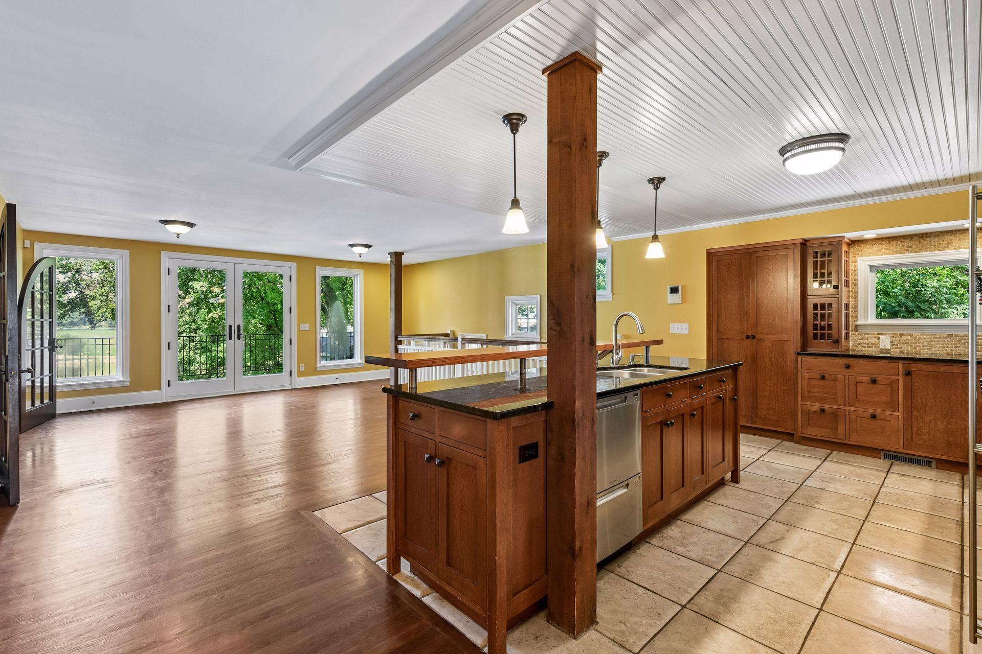Kitchen opens to the main living space and deck overlooking the lake.