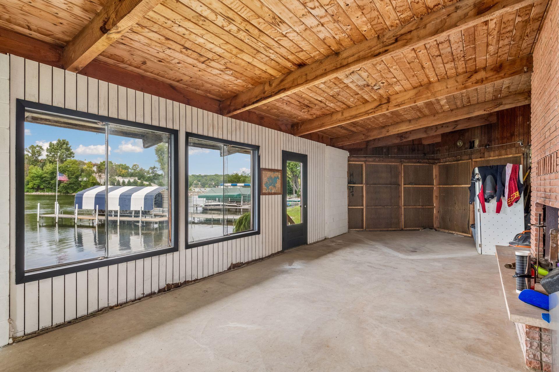 Inside the rare 38' x 16' grandfathered boathouse at the water’s edge.