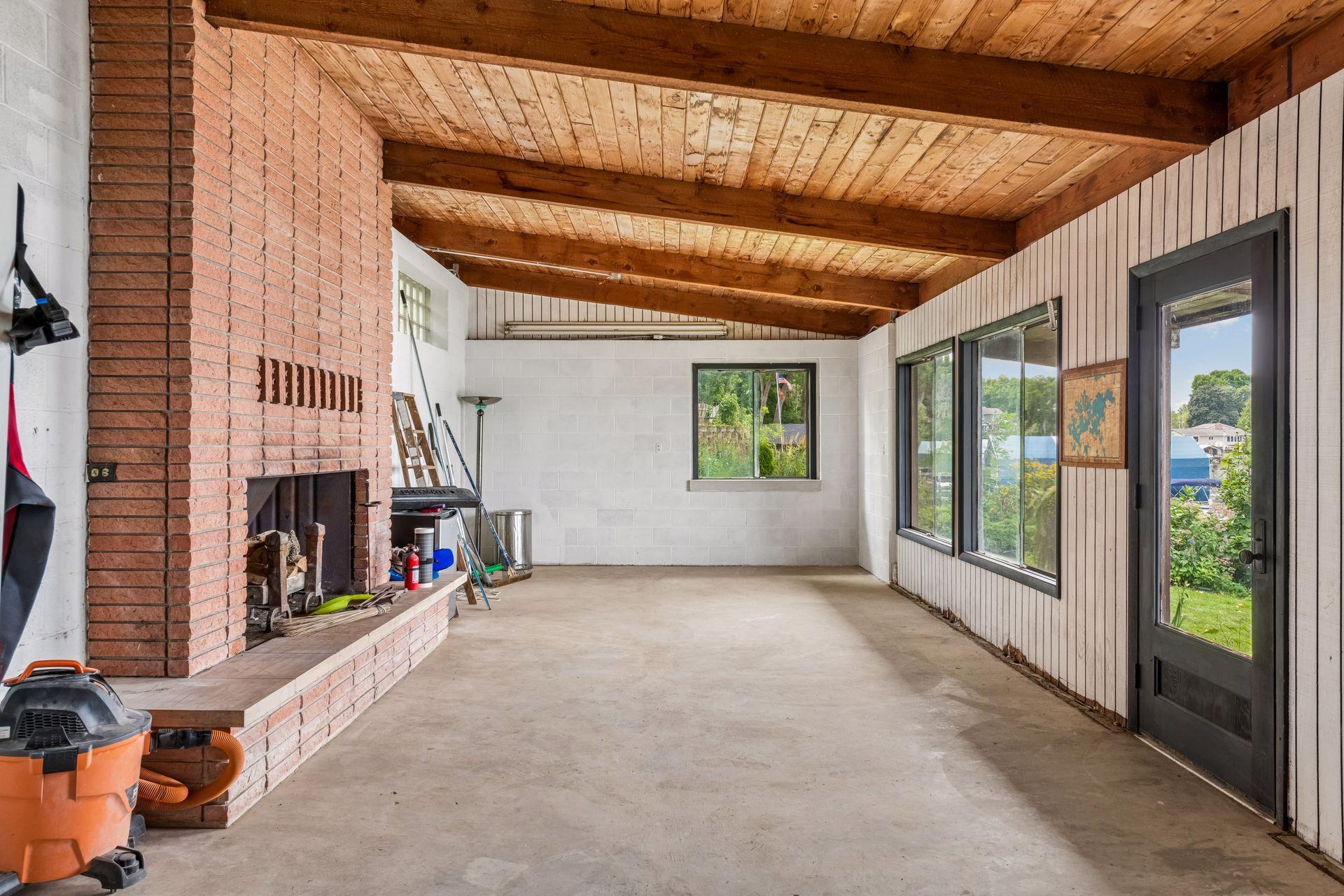 Boathouse features a full masonry wood-burning fireplace and lake views.