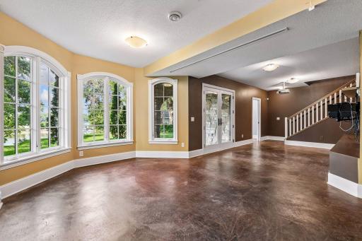 Actual -Finished walkout lower level with direct access toward the lake and lakeside 1/2 bathroom!
