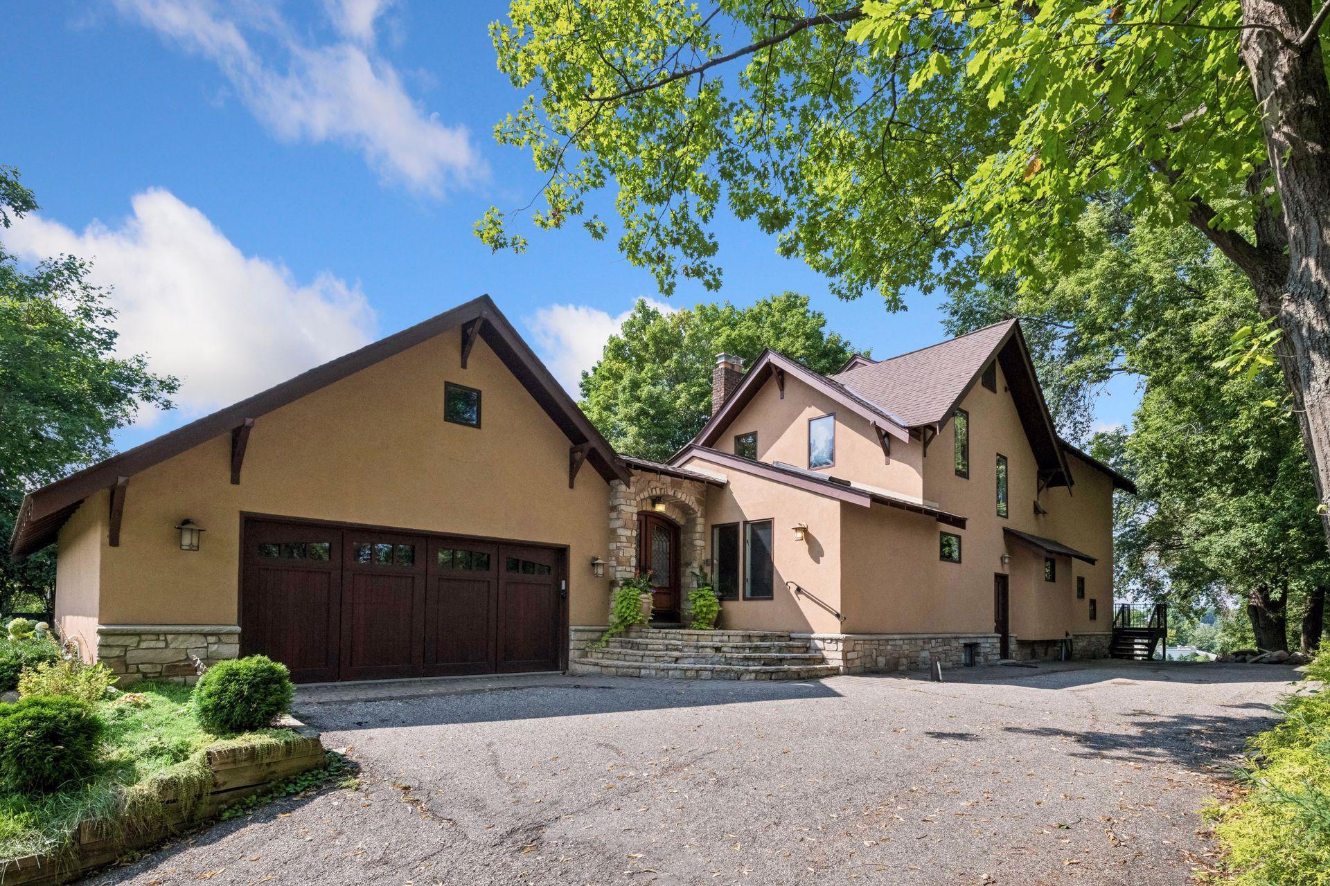 Two-stall attached garage complemented by beautiful stone exterior details.