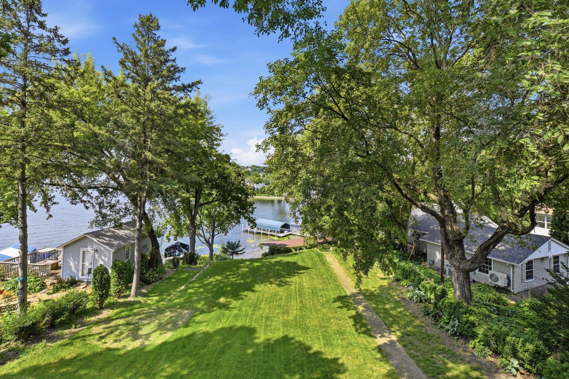 Expansive lakeside yard leading down to 123 feet of shoreline.