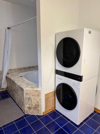 2nd floor bathroom with in-unit laundry, soaking tub/shower