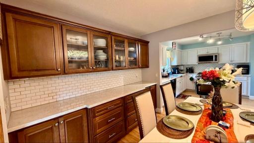 Warm wood cabinetry pairs perfectly with an open dining nook