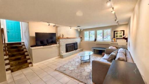Stone fireplace anchors this inviting living room