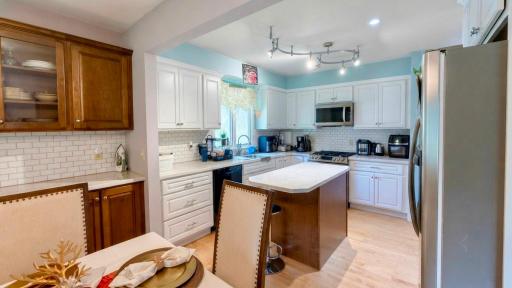 Crisp white kitchen cabinetry throughout