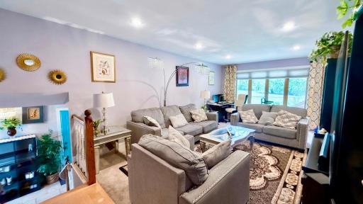Spacious living room with a cozy sectional and tons of natural light. Room to stretch out and relax.