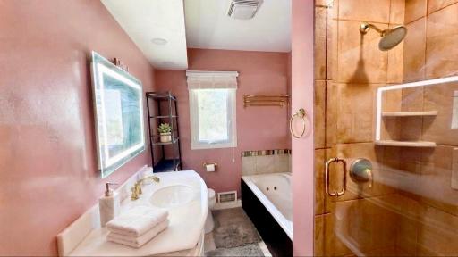 Spa like bathroom with a soaking tub and separate glass shower. Your private retreat awaits.