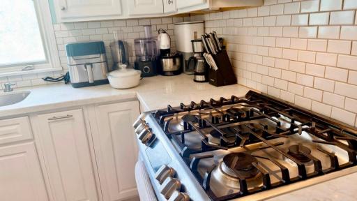Chef ready range with subway tile backsplash. Built for the home cook who means business.