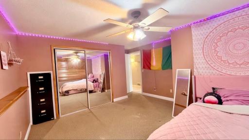 Bedroom with playful character, ready for a playroom, studio, or hobby space.