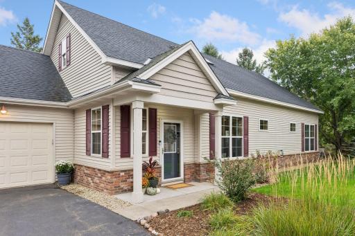 A spacious inviting front entry with a lovely garden welcomes family and friends.