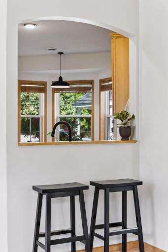 A snack bar between kitchen and living area is great for chatting with the cook while entertaining or a snack time for the family.