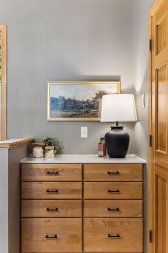 Primary bedroom includes an additional vanity area great for extra space to get ready and for hiding all those toiletries out of sight.