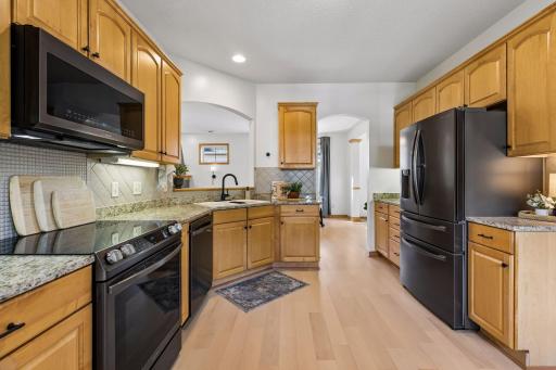 The new LVP flooring flows into the kitchen.