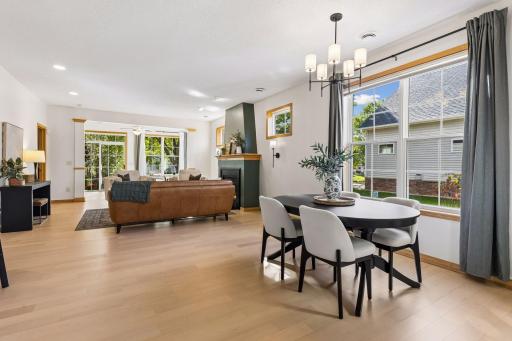 This large open concept living, dining, and sunroom with new LVP flooring is great for families and entertaining. The big beautiful windows fill the space with natural light.