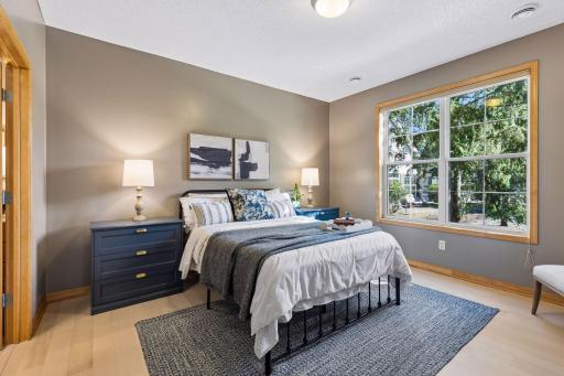 A large main floor primary bedroom with ensuite bath and walk-in closet is another convenience, and also boasts the new LVP flooring.