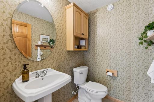 Half bath off main living area is handy for family and guests alike.