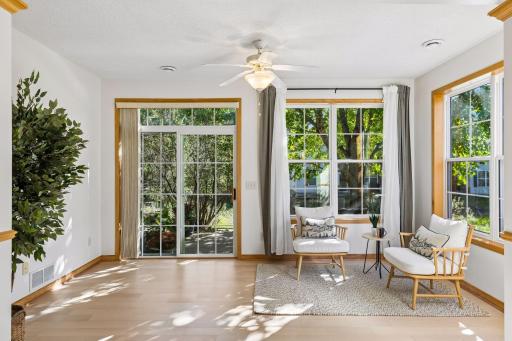 The sunroom off the living room provides even more light filled living space.