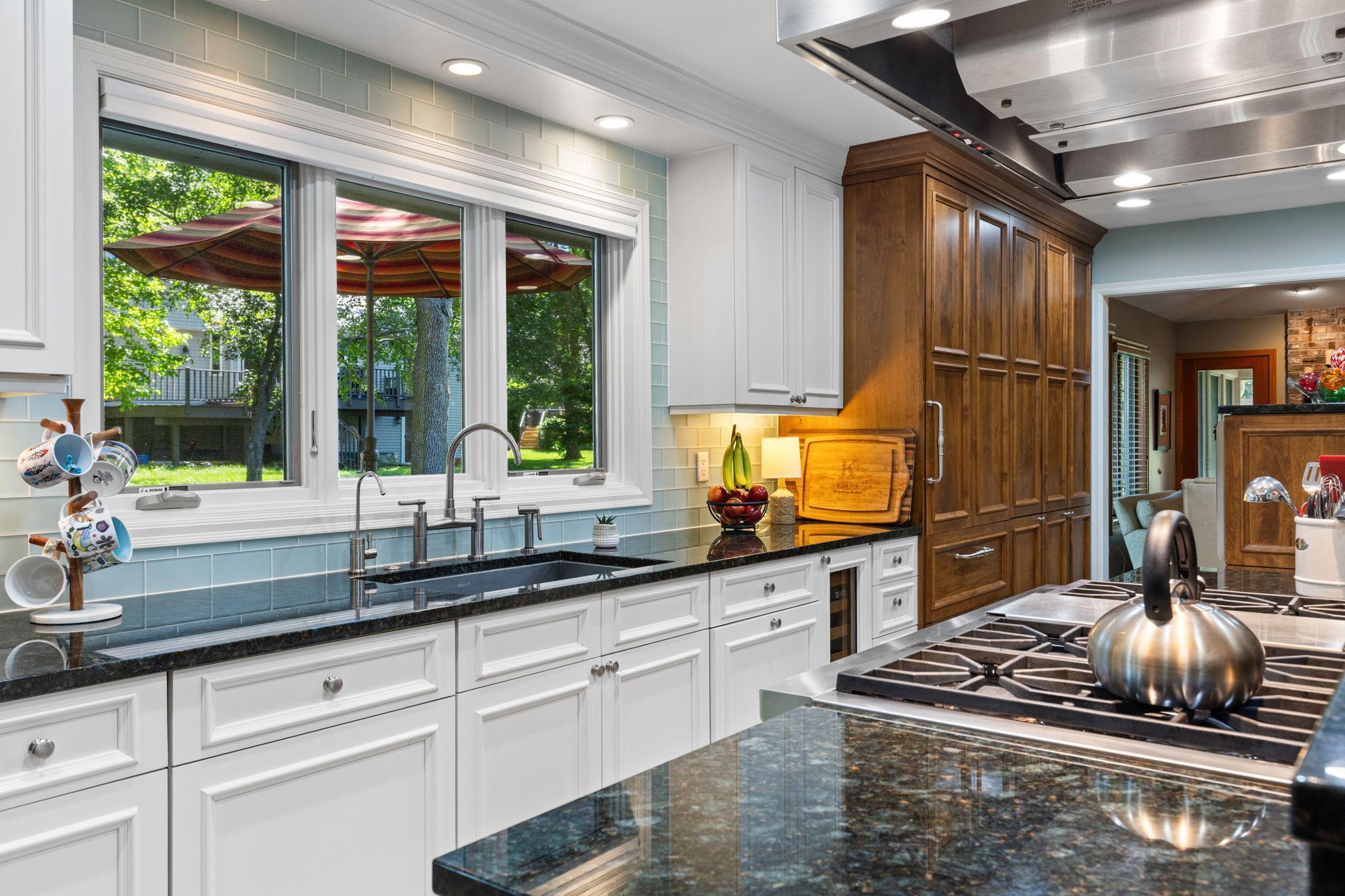 Two-tone cabinetry, soft-close drawers, and designated beverage fridge!