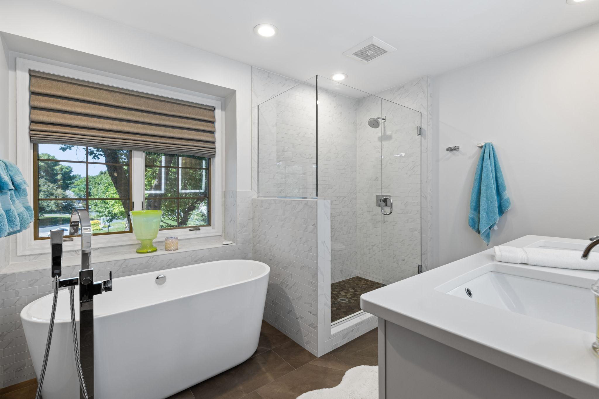 Soaking tub, tiled walk-in shower, and double vanity!