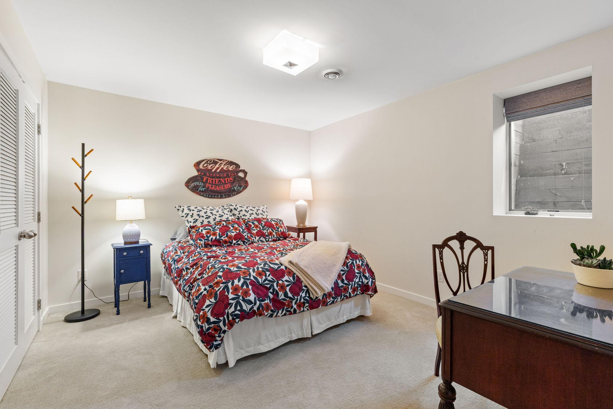 The fourth bedroom, accessed through French doors, provides excellent flexibility for guests, a home office, or a private retreat.