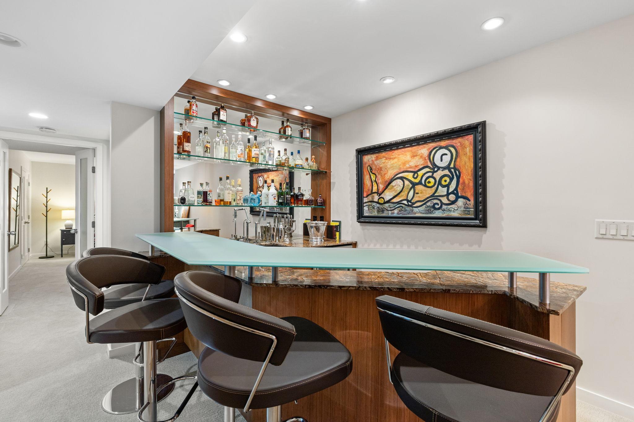 Beverage fridge, microwave, and shelving for displaying favorite items.