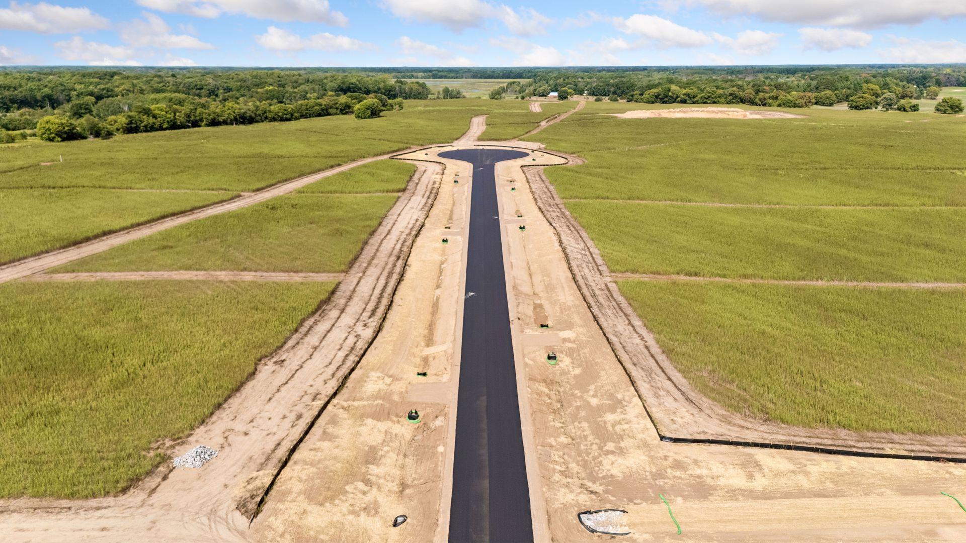 Professional photos are taken of the entire development and may include other parcels.