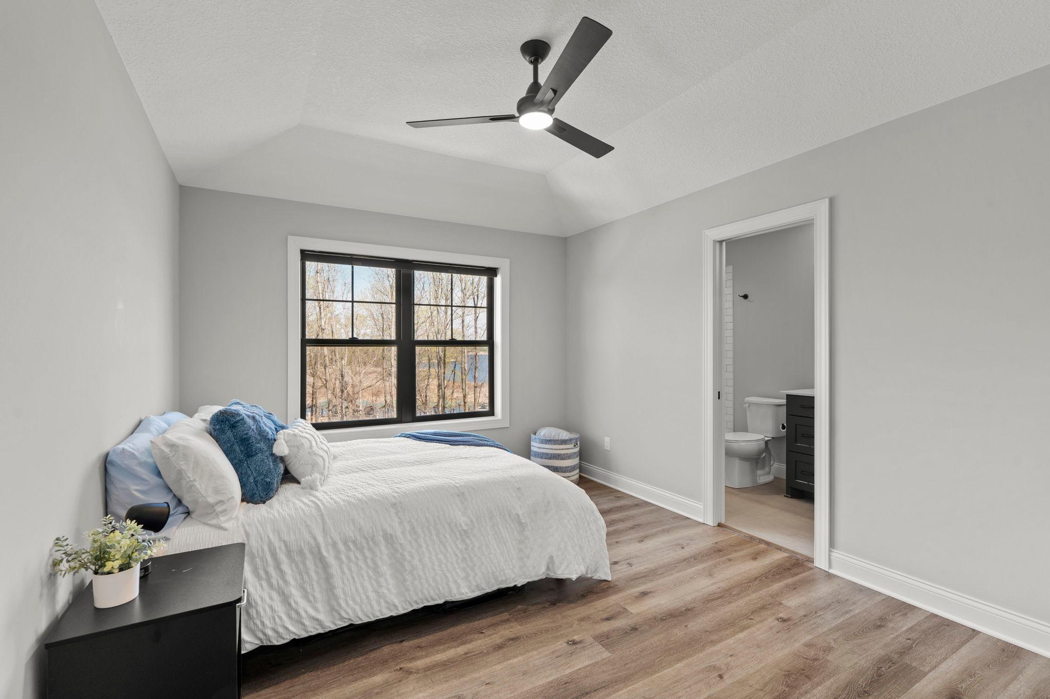 One of the 4 bedrooms located on the upper level - all 4 bedrooms on the upper level feature their own bathroom