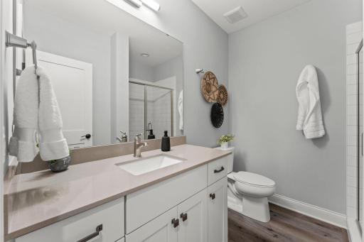Lower level features a 5th bedroom and 3/4 bathroom