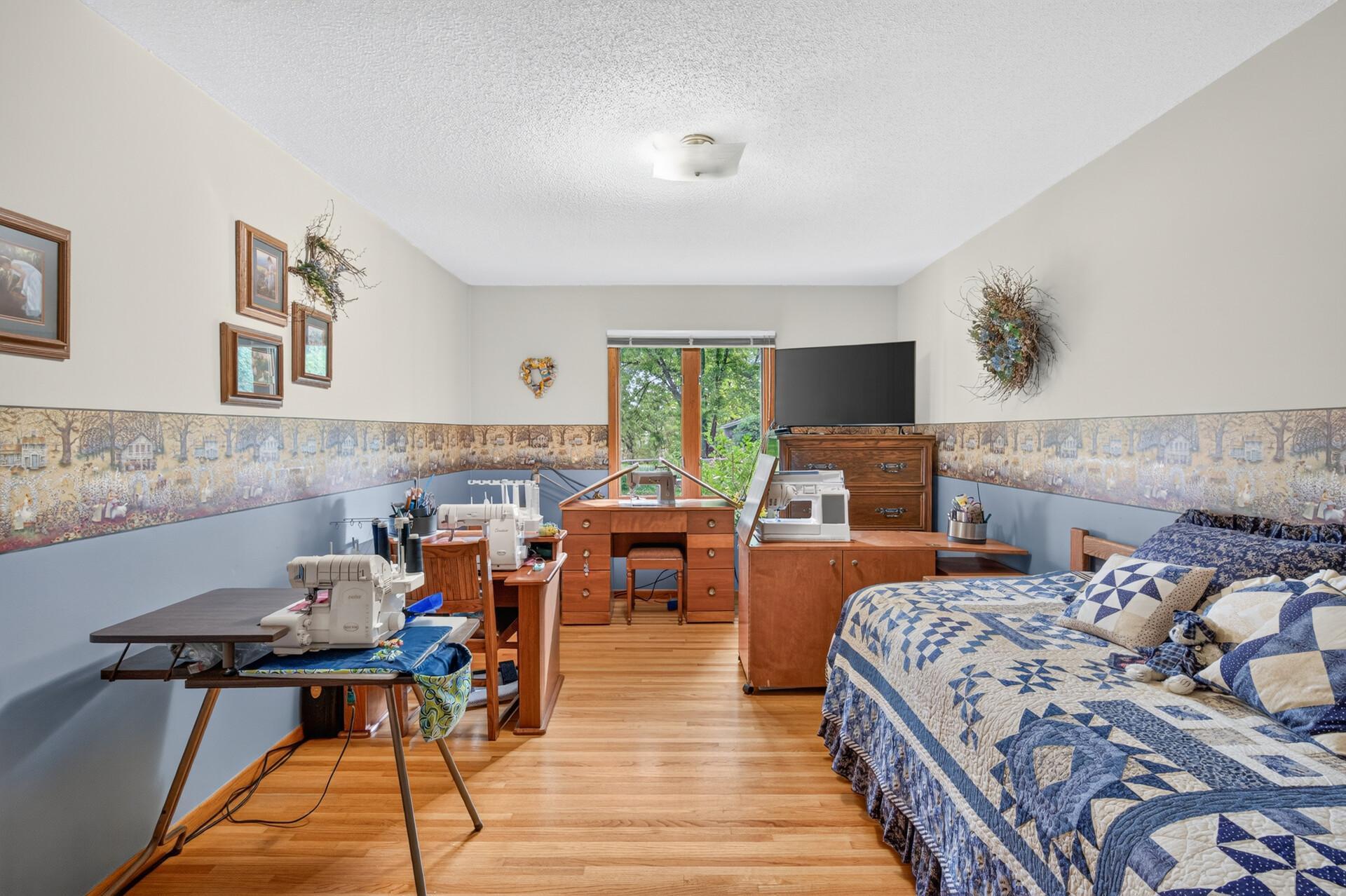 Spacious bedroom #4. Currently being used as a sewing room. A great spot for an office, reading area, or TV room.