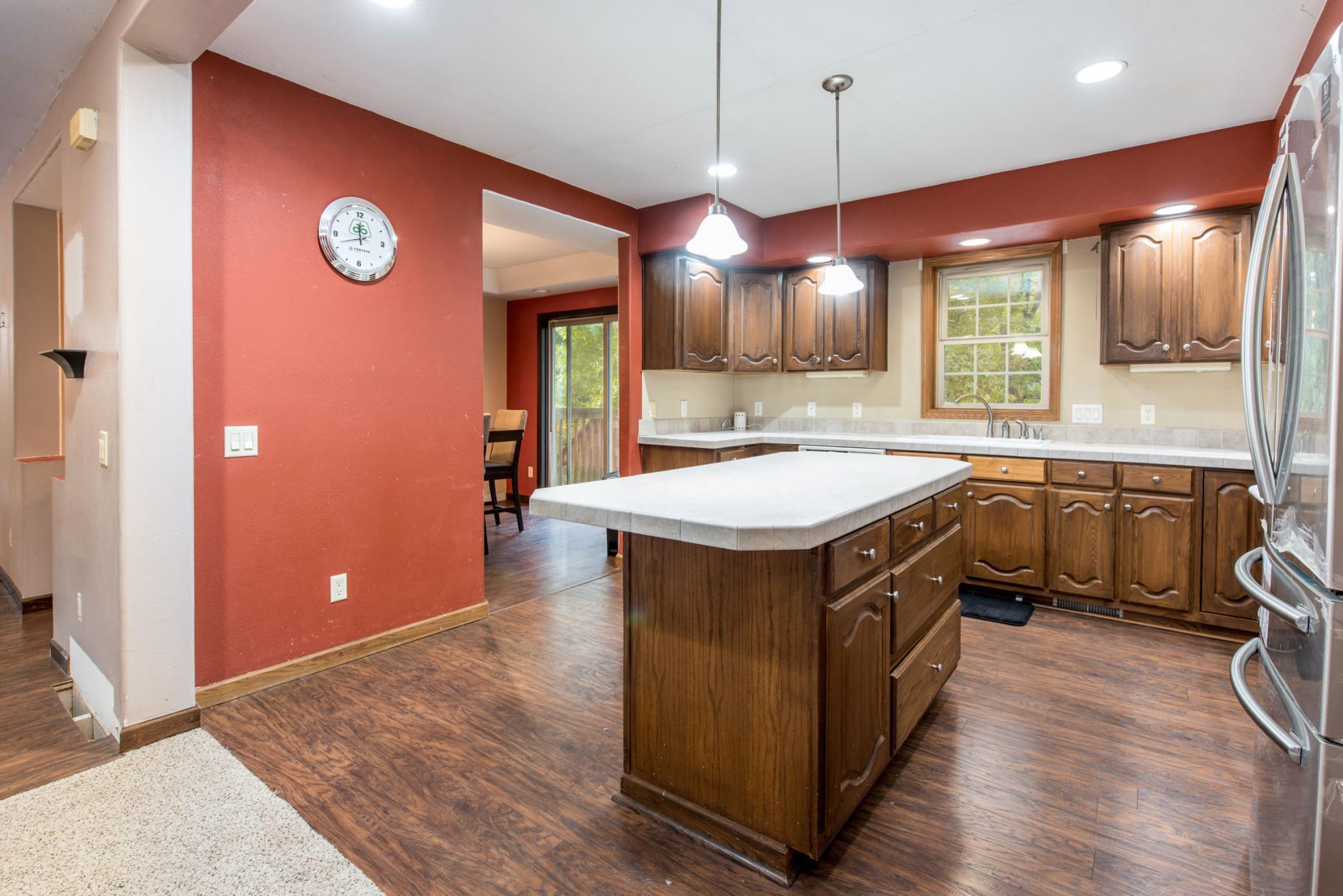 Dining room with slider to deck beyond the kitchen
