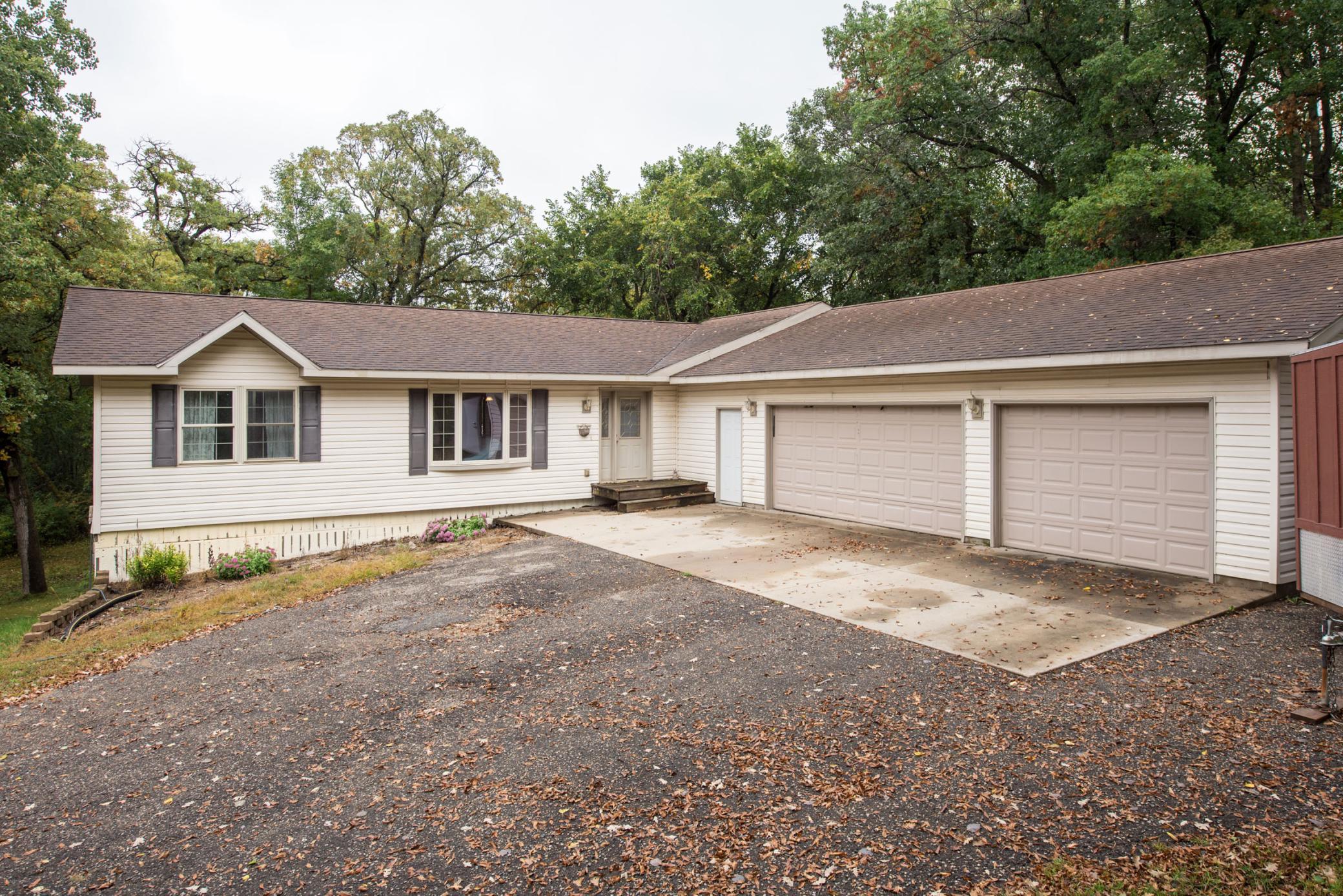 Asphalt drive + large concrete apron