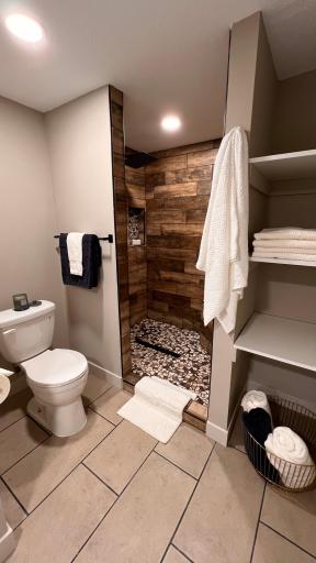 Primary bathroom with walk-in tile shower