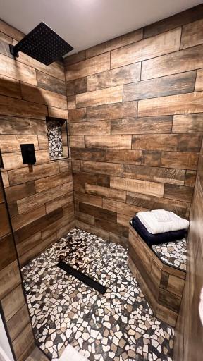Primary shower with bench, rain shower