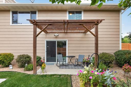Walkout to the private patio with pergola