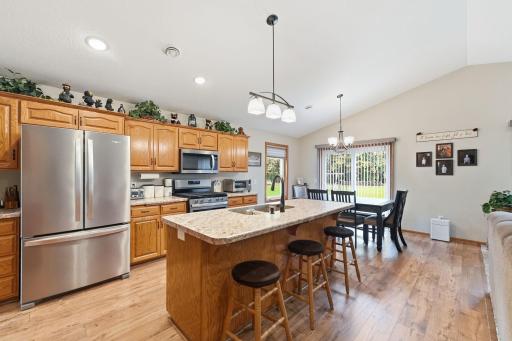 The crisp finish of modern stainless steel appliances strikes a flawless balance with the bespoke charm of handmade solid oak cabinetry.