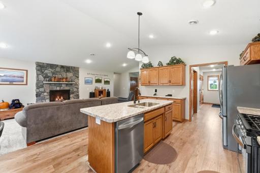 Down the hall, beyond the kitchen is the mechanical room (with insulated wall to reduce sound transfer), 8x7 walk in pantry, laundry, 1/2 bath and the 3 car garage.